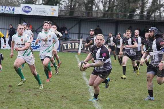 Cornish All Blacks player/coach Ryan Westren, who also scored one of their seven tries, looks to spread the ball through the backs during their emphatic 43-12 victory over Newton Abbot at Polson Bridge last Saturday. Pictures: Paul Hamlyn