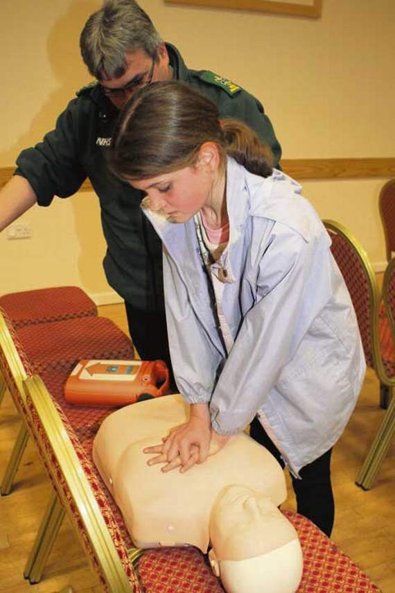 Andrew Painter explains CPR to Tilly Greathead. Pictures: Dawn Bewes