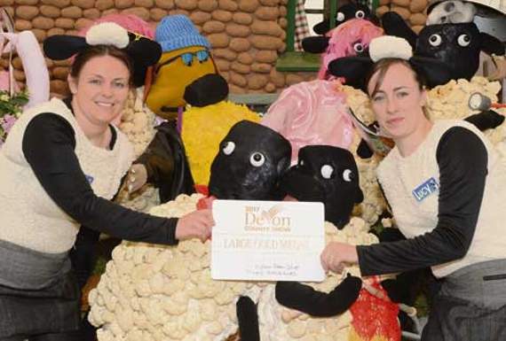 Large gold medal winners with ‘Shaun The Sheep’ are members of the Lifton Farm Shop Sarah Wills and Lucy Bounsall. Picture: Adrian Jasper