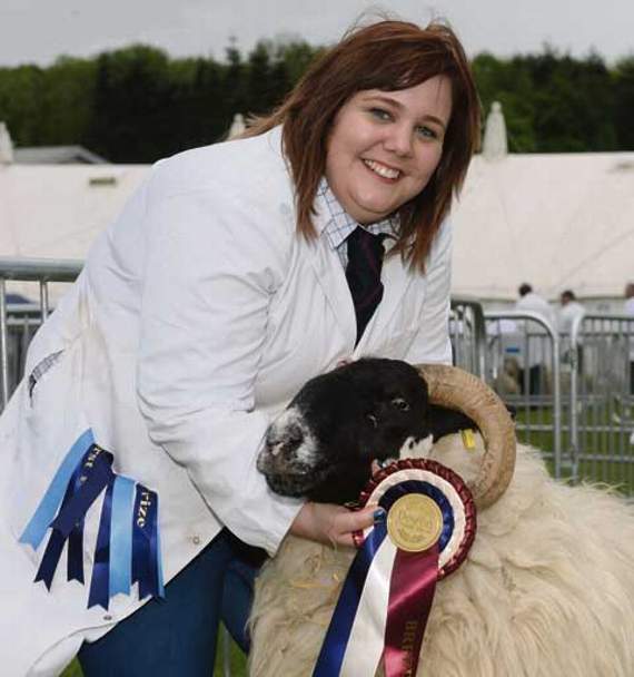 Abbey Cornelius along with the Champion winner a Scotch Black-Faced Sheep showing on behalf of P H Cornelius of Davidstow. Picture: Adrian Jasper