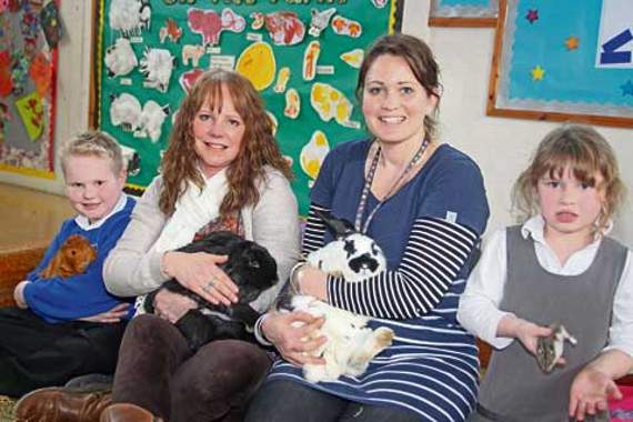Staff with some of the pupils and their pets. Picture: Paul Hamlyn
