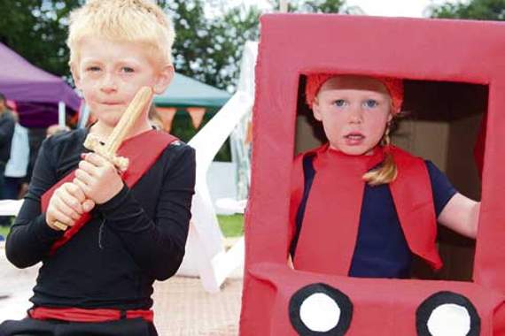 Fancy dress winners as a soldier and Postman Pat.