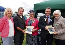 Winners presented with copies of new show books
