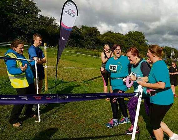 At the finish line is Melissa (centre) with support team Steph Jones-Giles (left) and Debi Jory.