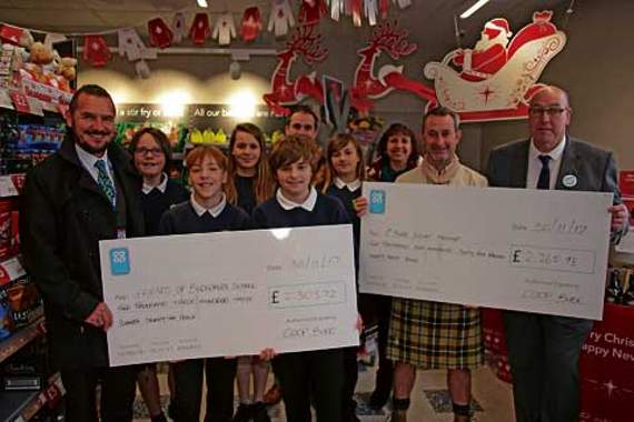 Bude Co-op presents cheques to Bude Scouts and Budehaven Community School. Pictures: Paul Hamlyn