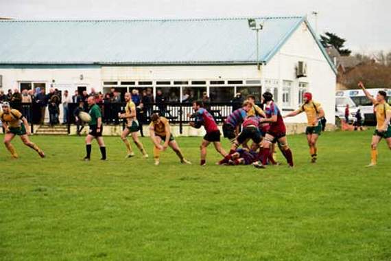 Bude scrum-half Olly Mounce looks to get the ball out to the backs.