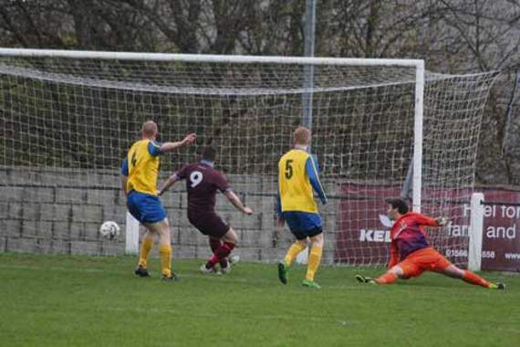 Launceston winger, Chris Head (out of picture), fired the ball past the Callington Town goalkeeper from a tight angle on his way to a hat-trick against the visitors at a sunny Pennygillam last Thursday night. Clarets striker, Louis Irwin (9), followed up just in case. Picture: Paul Hamlyn