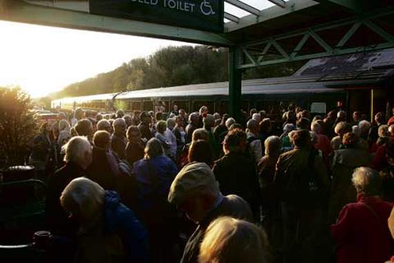 Passengers joining the train.