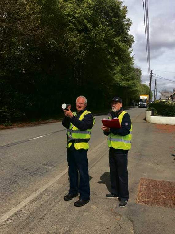 Bob Piddington and David Campbell monitoring the speed of an oncoming vehicle through Halwill Junction.