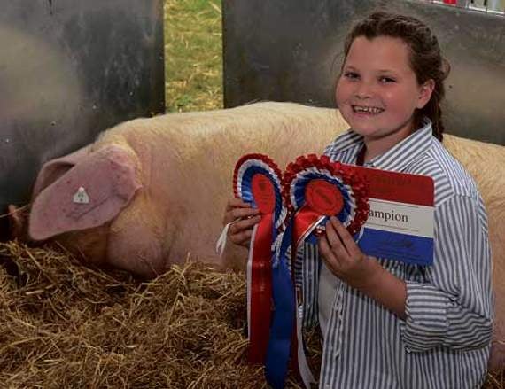The British Lop breed champion prize went to ‘Cilla’, belonging to Emma Collings, Launceston. Pictured here with the prize winning pig is Mia Williams, who helps Emma at the shows.