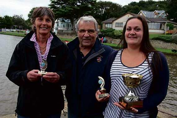 Chris Bale is pictured presenting cups to the ladies rowing boat competition winner Kirsty Walton from Bude (right), and runner up Sharon Hicks from Bude.