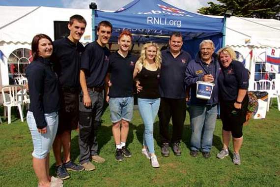 In front of the RNLI marquee are members of the Bale family who are volunteers and crew members.