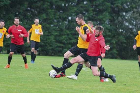Altarnun striker Sam?Smith looks to run through two players during their Cornwall Junior Cup tie with Nanpean Rovers. Picture: Paul Hamlyn
