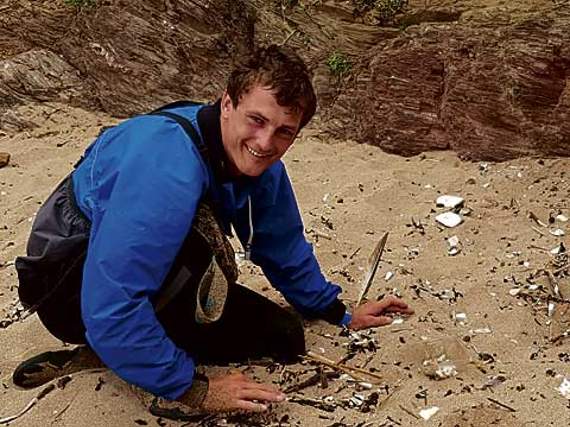 Brad gets stuck in with cleaning up the beach.