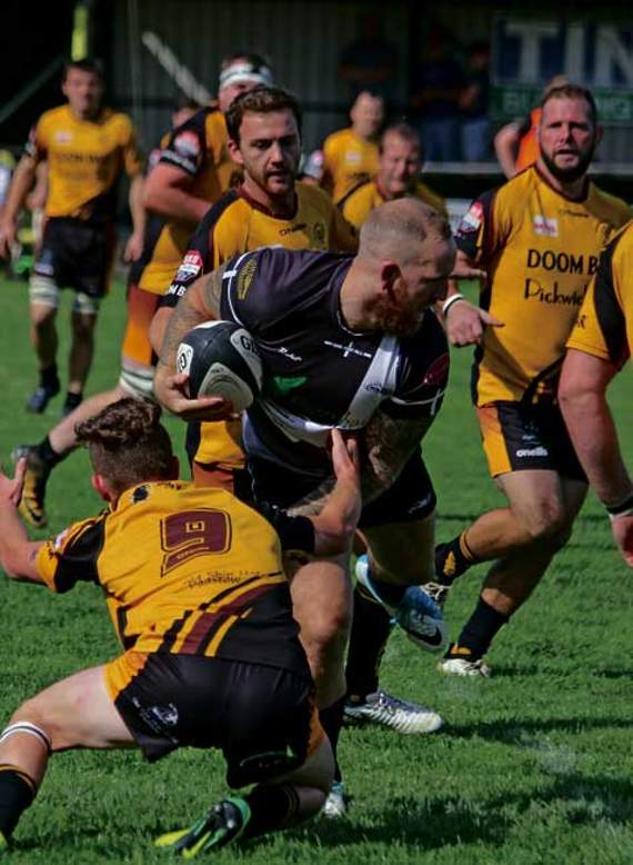 Joint head-coach Ryan Westren was in typically abrasive form from his position at outside-centre. He’s pictured trying to get past the Wadebridge scrum-half.