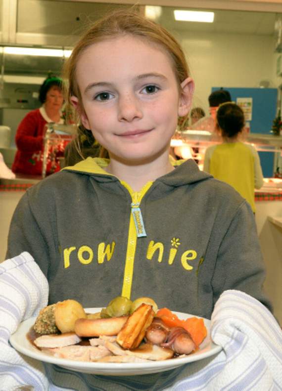Lowenna from 1st Camelford Brownies serves up the lunch.