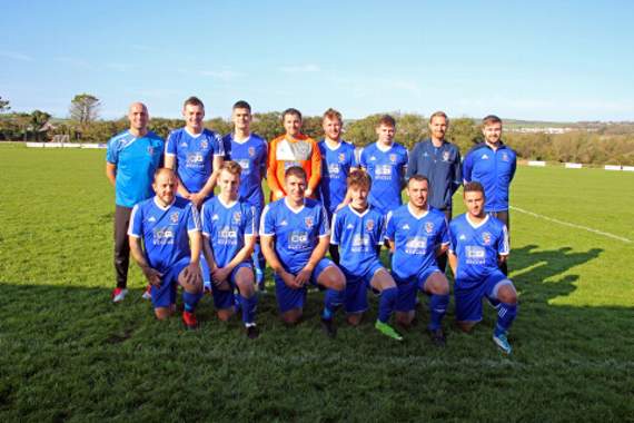 Bude Town picked up their first home win of the season on Saturday in Division One (West) of the Carlsberg South West Peninsula League as they beat Penzance 3-2 in a thriller at Broadclose Park. Man-of-the-match Harry Hopcroft’s brace put the Seasiders 2-1 up before the West Cornwall club equalised. However, Jack Watson slotted home the winner shortly after the break. Back row: Paul Banks, Chris Hill, Liam Sandercock (captain), Gary Dinshaw, Jason Winser, Harry Hopcroft, Ryan Leverton (former manager) and Chris Ward. Front row: Tommy Statton, Alex Harrison, Josh Allen, Yassem Cooke, Wes Pugh and Nathan Bonney. Picture: Paul Hamlyn