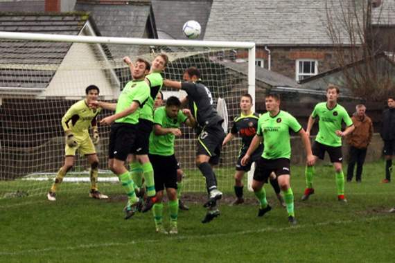 Bradworthy duo Toby Durling (left) and Gary Clarke (right) jump to head the ball away from their box during their 3-2 defeat to Shamwickshire Rovers on Saturday. The result leaves them third bottom with just five points from their opening ten games. Picture: Dawn Bewes
