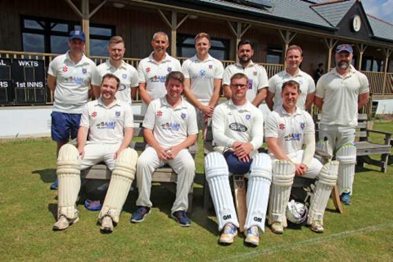 Launceston firsts shot into mid-table over the Bank Holiday weekend in County Division One after convincing victories over St Austell seconds and Rosudgeon. On Saturday, they knocked up a massive 283-9 at home to St Austell with eight batsmen passing 20, the best of which was skipper Kevin Worth’s 56 off 38 balls. Cornwall Over 50s bowler Pete West then rolled back the years with 6-36 off his ten overs as the visitors were all out for 167. Less than 48 hours later they made the long trek down west and came away with an impressive 66-run victory at fourth-placed Rosudgeon. After finding themselves in trouble at 113-5, Sam Pengelly (81) and Worth (79 off 47) steered them up to an imposing 253 all out. Rosudgeon got off to a good start and at 134-4 were well in the game. However the dismissal of dangerman Giles Lawrence for 44 to Robert Mutch (2-34) swung the game in the favour of Launceston before they eventually bowled the hosts out for 187. Spinner Andrew Yelland picked up 4-28. They’ll hope to keep up the good work when they welcome Redruth seconds to Lawhitton on Saturday (1pm). Back row: Andrew Yelland, Michael Bolt, Pete West, Sam Pengelly, Brandon Forsyth, Ryan Christophers and Brett Grosvenor. Front row: Dan Tilley, Kevin Worth (captain), Robert Mutch and Michael Diebner. Missing from picture: Gavin Wallis. Picture: Paul Hamlyn