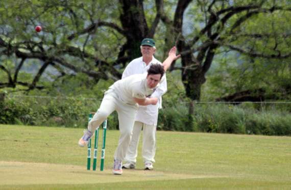 Will Harvey runs in for Launceston thirds against their Menheniot-Looe counterparts in Division Six East as umpire Michael Conbeer watches on.