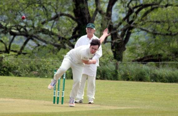 Will Harvey runs in for Launceston thirds against their Menheniot-Looe counterparts in Division Six East as umpire Michael Conbeer watches on.