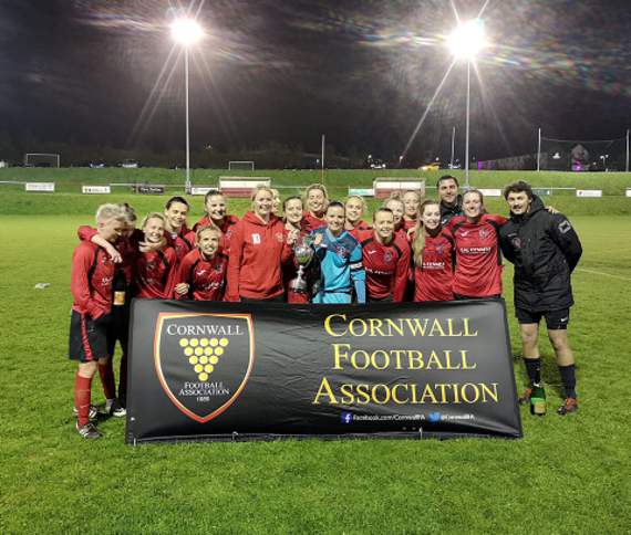 Callington's players and management celebrate a third successive Cornwall FA Womens Cup title crown.
