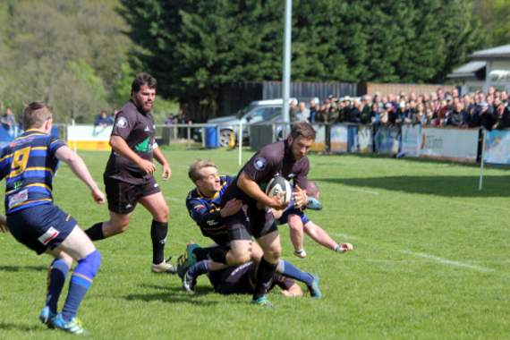 Winger Martin Kneebone, pictured being tackled, ended as the club’s top try-scorer with 17, following his 56th minute effort after a fine pass from fly-half Glenn Coles.