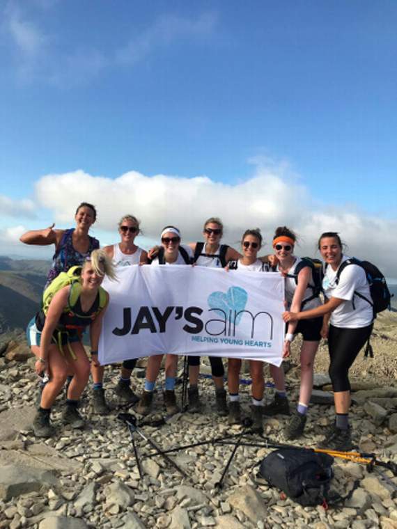At the summit of Scafell Pike. From left: Rebecca Stanbury, Lizzie Crocker, Sam Ford, Rebecca Moore, Sophie Colwill, Lucy Olde, Emma Henderson and Claire Fry.