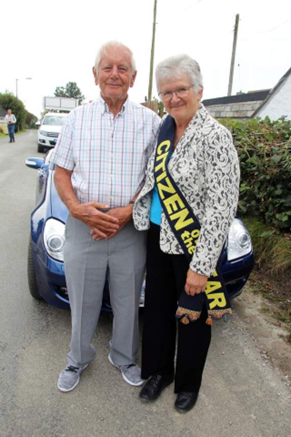 Len Davis is pictured presenting a sash to this year’s Citizen of the Year, Lesley Booker.