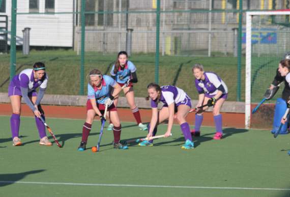 Bude’s Leanne Stanbury, who scored twice on Saturday, shields the ball as Okehampton’s defenders surround her. Pictures: Paul Hamlyn