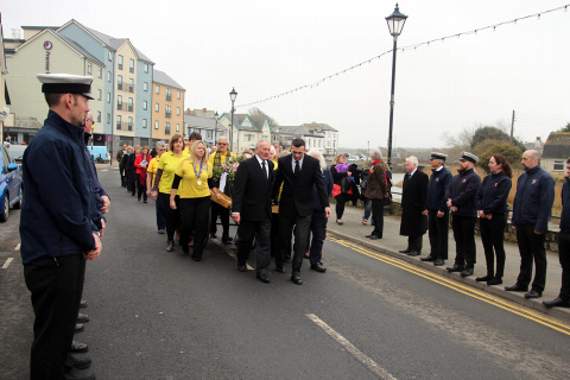 Bude carnival committee with Margaret’s coffin, about to be received by Bude RNLI members on the Strand. Picture: Paul Hamlyn