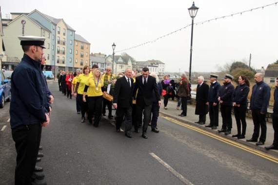 Bude carnival committee with Margaret’s coffin, about to be received by Bude RNLI members on the Strand. Picture: Paul Hamlyn