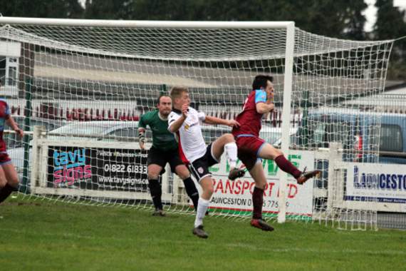 Launceston Reserves full-back Alex Shopland puts his body on the line on Saturday at home to St Austell Reserves as goalkeeper Nick Oldaker watches on. Picture: Paul Hamlyn.