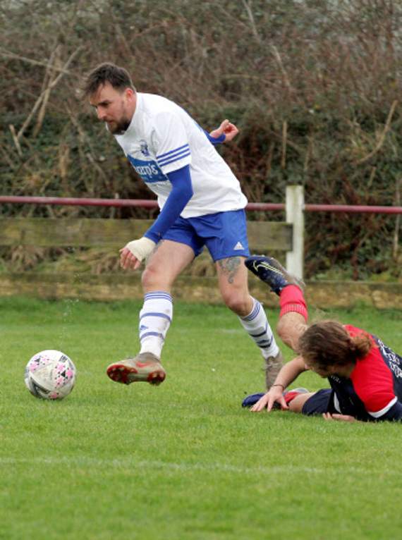 St Minver’s Jason Keatley leaves his opponent on the floor as he advances towards goal. Picture: David Flower