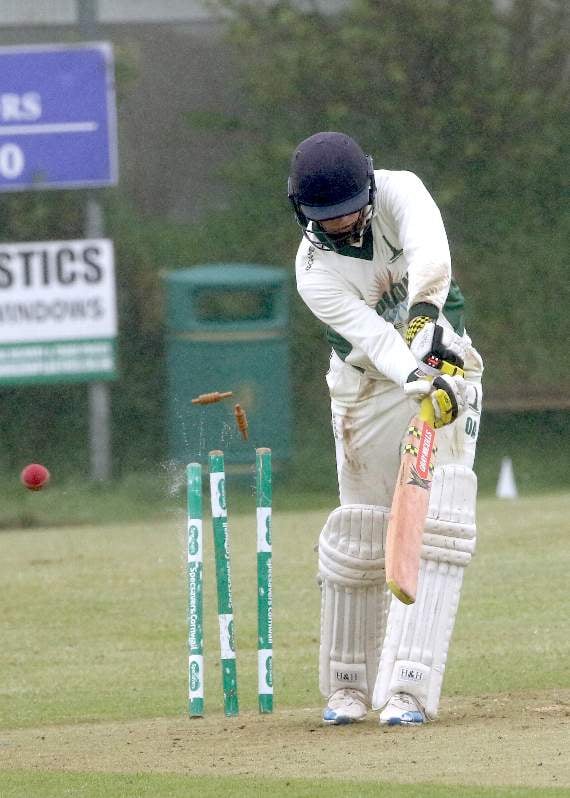 Ollie Allsop is bowled by St Just's Matthew Ellis.