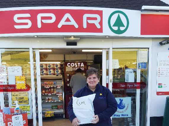 A Marie Curie nurse picking up PPE from her local Spar in Dobwalls in the early part of the pandemic last year