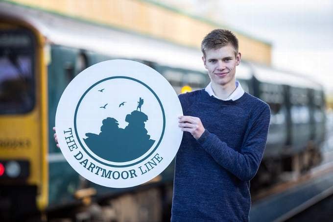 Okehampton teenager Tom Watts with his winning design for a new logo for the refurbished Dartmoor Line passenger service.