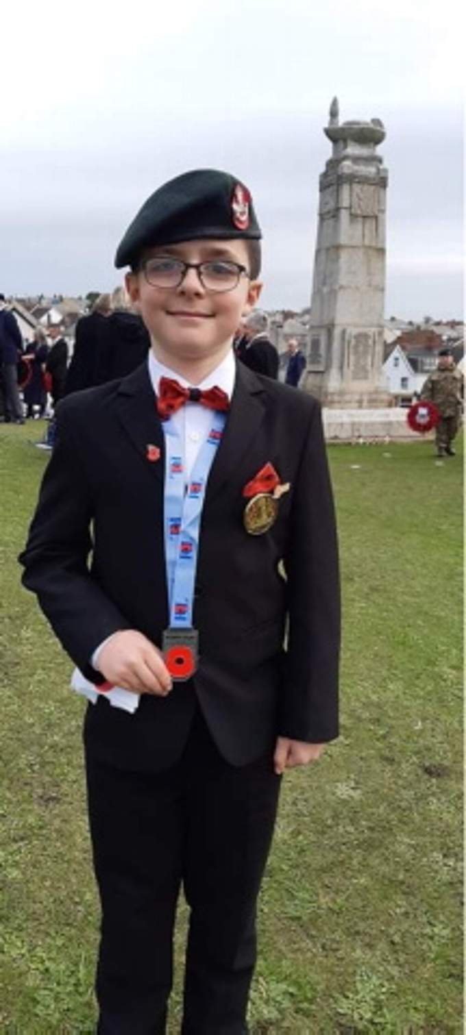 Kieran pictured on Shalder Hill with his prized medallion that three local jewellers helped mount so he could wear it during the parade