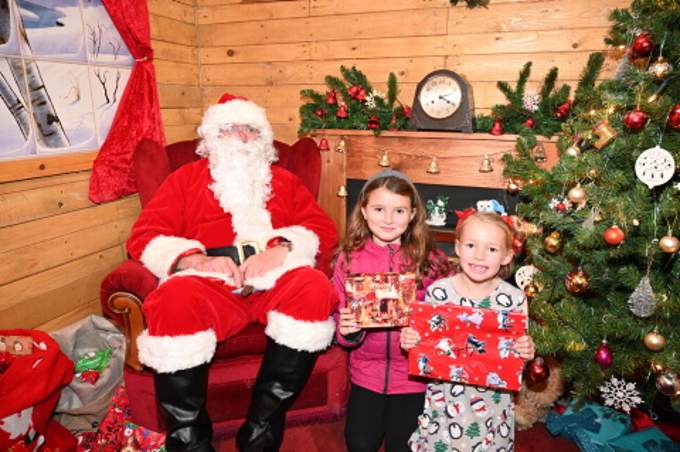 Happy to receive a gift from Santa are Tamelia and Leticia. Pictures: Adrian Jasper