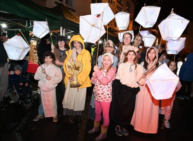 The lantern parade makes its way through the town centre