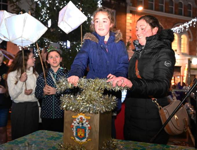Delighted to illuminate Launceston is Lydia Gardener, as her mother looks on