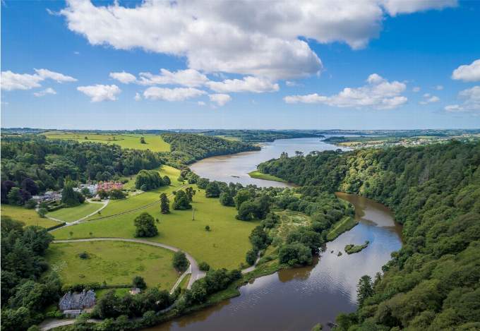 An aerial view from above Maristow House of the River Tavy nearing its confluence with the Tamar, visible in the distance, near Bere Ferrers in West Devon.