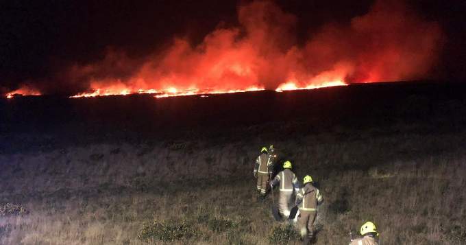 Firefighters head towards the flames lighting up the evening sky at Rosenannon Downs. Picture: Wadebridge Community Fire Station