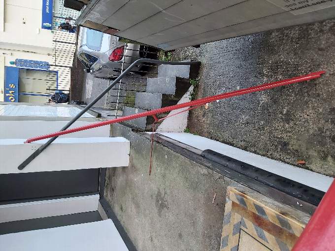 A railing broken by a vandal at the Cornwall Air Ambulance shop in Bodmin