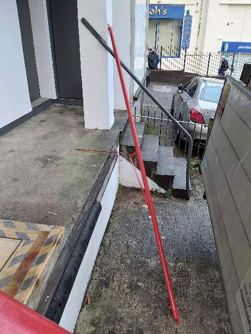 A railing broken by a vandal at the Cornwall Air Ambulance shop in Bodmin