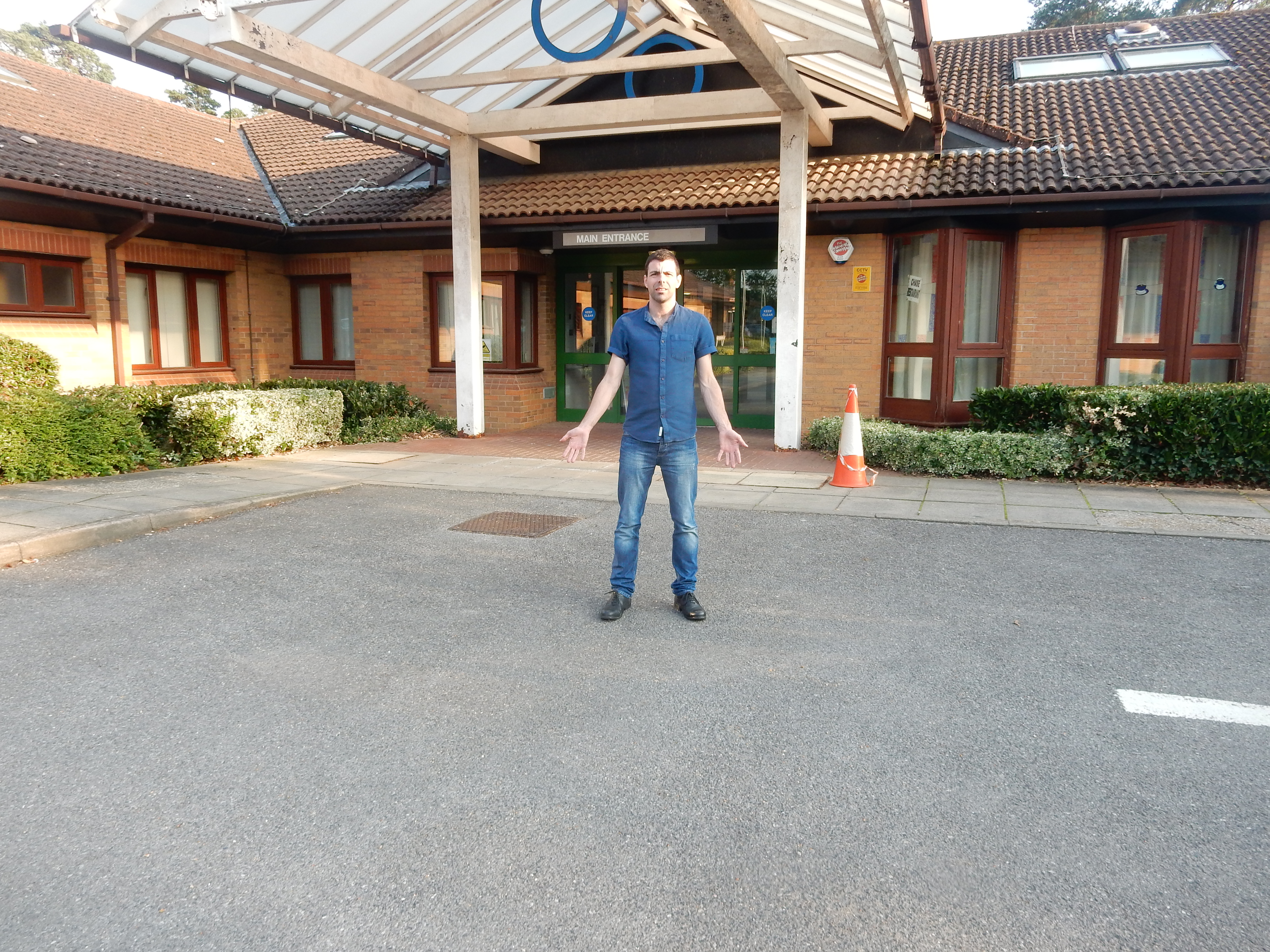 <p>Cllr Andy Tree outside Chase Community Hospital in Bordon</p>