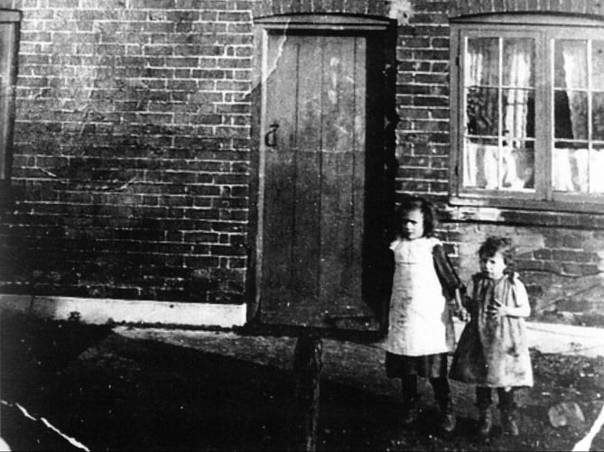 Two of William Crumplin’s sisters appear in this photo outside the house in about 1914. Ellen (Nellie) is on the right with Dorothy (Eddie).
