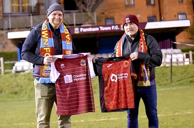 Jean-Claude Vacassin and Paul Tanner celebrate the merger
