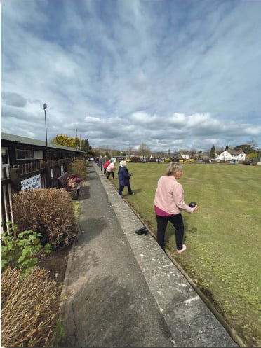 Members of the club bowling on the green