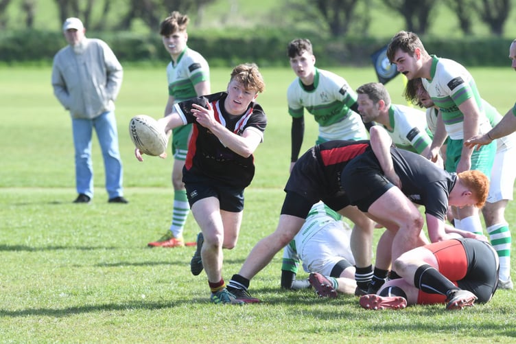 On loan to Western Vikings for the day, Douglas squad player Kyle Martin passes the ball out from a ruck. Emerging Nomads ultimately lost out to a strengthened Vikings side containing at least four Douglas regulars (DK220409(193))